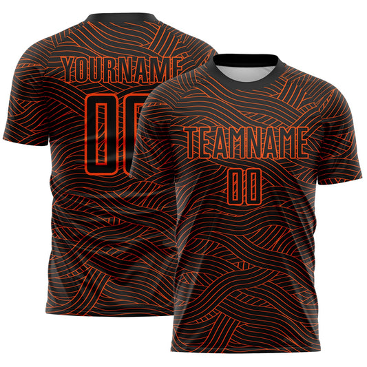 Custom Black-Orange Abstract Wave Lines Interlocking Sublimation Soccer Uniform Jersey - Main View